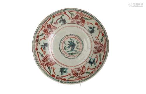 A polychrome porcelain deep charger, decorated with flowers....