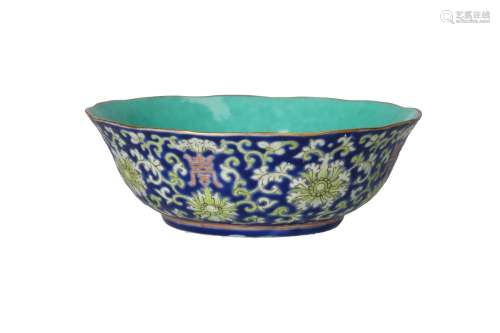 A polychrome porcelain bowl with scalloped rim, decorated wi...
