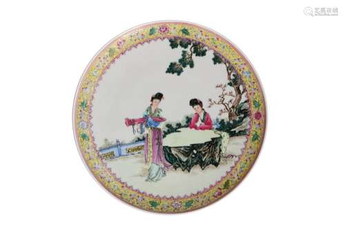 A polychrome porcelain plate, decorated with two ladies in t...
