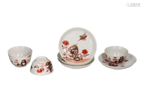 A set of four polychrome porcelain cups and saucers with a f...
