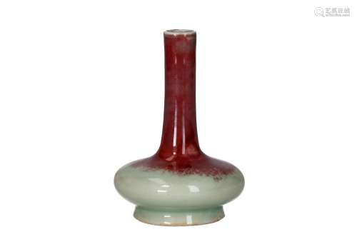 A copper red glazed porcelain bottle vase. China, 19th centu...