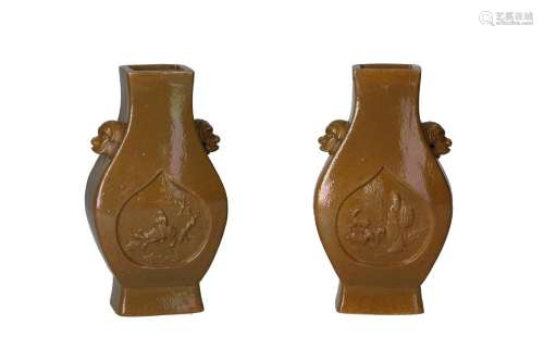 A pair of teadust glazed porcelain vases with handles shaped...