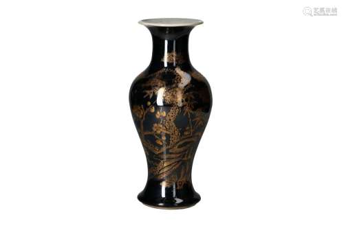 A famille noir porcelain balustre vase, with gilt decor of f...