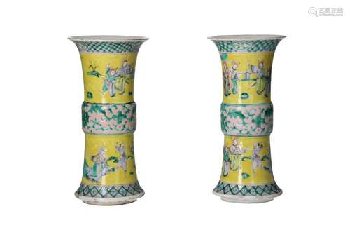 A pair of polychrome porcelain Gu shaped vases, decorated wi...