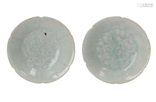 A pair of celadon glazed porcelain saucers with scalloped ri...