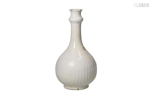 A blanc de Chine porcelain bottle vase with lobed neck and a...