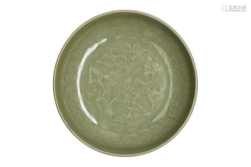 A celadon earthenware deep saucer with underglaze decor of f...