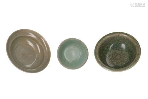 Lot of three celadon glazed bowls. 1) Early Ming. H. 5 cm. D...