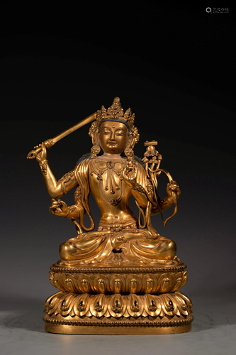 A Sino-Tibetan gilt bronze figure of four-armed