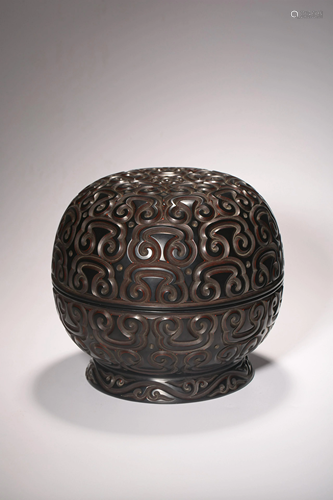 A Chinese lacquered round box and cover, carved with