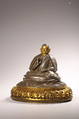 A Chinese silver and gilt bronze figure of a Buddha, H