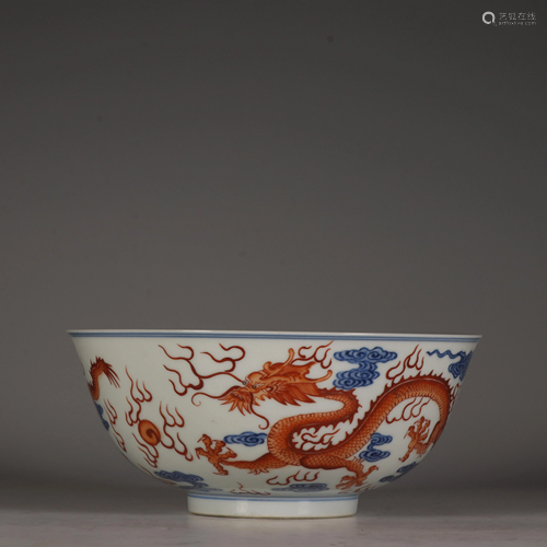 A Blue and white and iron-red dragon bowl, with