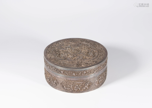 A Chinese silver round box and cover, carved with