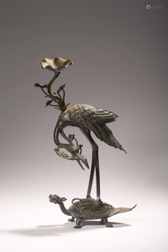 A Chinese silver group depicting a crane on a toad,