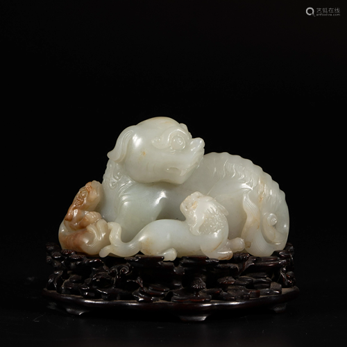 A Chinese russet and white jade carving group of