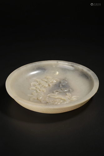 A Chinese carved grey jade dish, carved with bats and