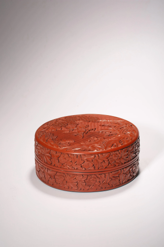 A Chinese cinnabar red lacquered round box and cover,