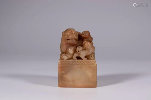 A Chinese Shoushan stone seal, carved with kylins atop,