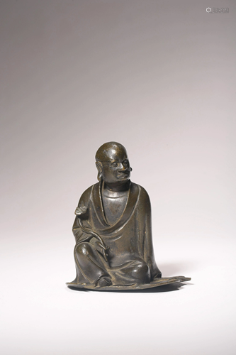 A Chinese bronze figure of an arhat, H 8 cm - Width 7