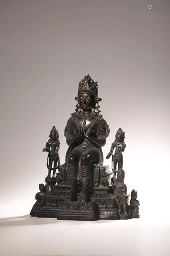 A Chinese zitan carving of Avalokiteshvara, inlaid with