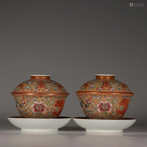 A pair of famille rose teabowls and cover or 'gaiwan',