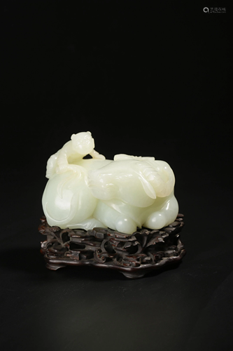 A Chinese white jade carving of a boy and an ox, L 10