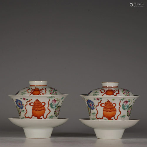 Two famille rose tea bowls and covers or 'gaiwan', with