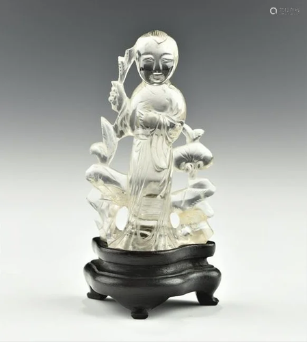 A CHINESE ROCK CRYSTAL FIGURINE