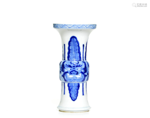 A CHINESE BLUE AND WHITE TAOTIE GU VASE