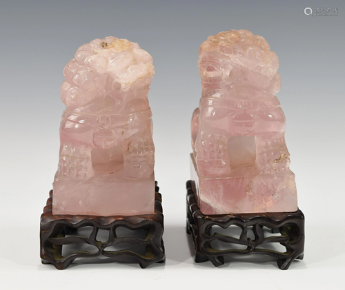 A PAIR OF CHINESE PINK QUARTZ FU DOG FIGURINES