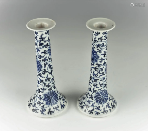 A PAIR OF CHINESE BLUE AND WHITE CANDLE HOLDERS