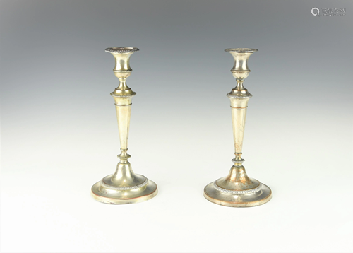 A PAIR OF ANTIQUE SHRFFIELD CANDLE HOLDERS