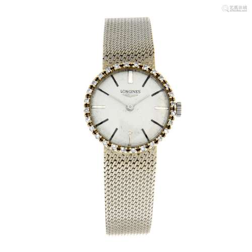 LONGINES - a bracelet watch.White metal case with factory di...