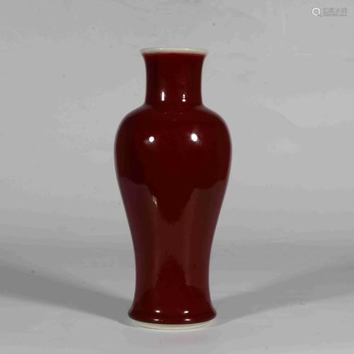 A MONOCHROME ALTAR RED GLAZED GUANYIN VASE