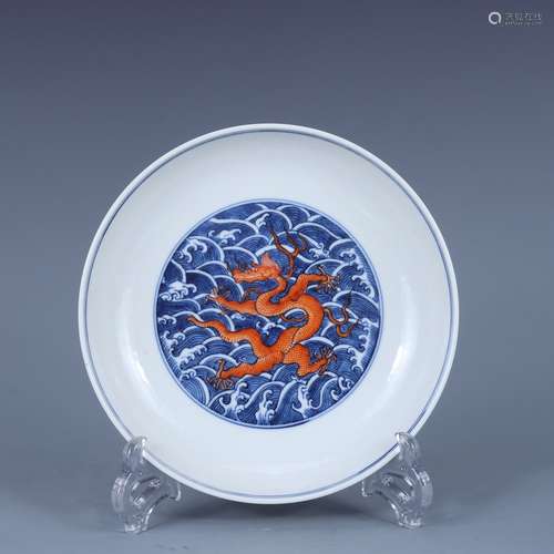 AN UNDERGLAZED-BLUE AND COPPER-RED DRAGON DISH