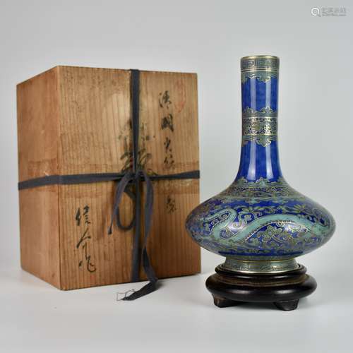 A BLUE-GLAZED FAMILLE ROSE DRAGON BOTTLE VASE