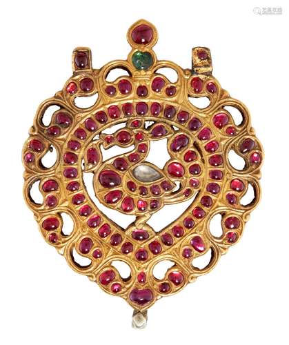 An exceptional ruby-set gold peacock pendant, South India, 1...