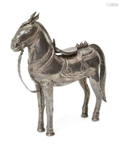 A silver horse, India, circa 1900, standing, the bridle and ...