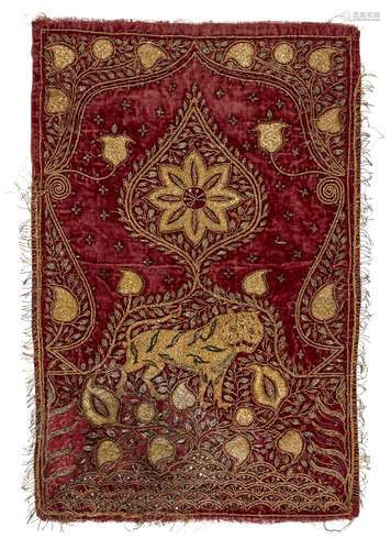 A gilt metal thread embroidered red velvet textile with tige...