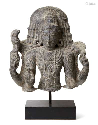 A black stone sculpture of Shiva, India, 19th century in a 1...