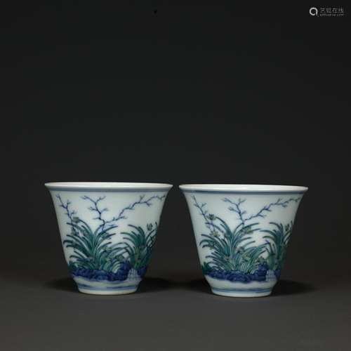 A Pair Of Blue And White Floral Cups