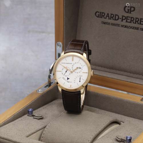 Girard-Perregaux. An 18K gold automatic annual calendar wris...