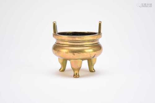 A Chinese bronze tripod censer