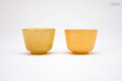 A pair of Chinese pale green jade wine cups, 18th/19th centu...