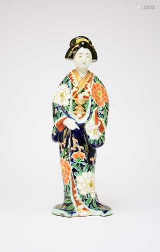 A Japanese porcelain figure of a bijin