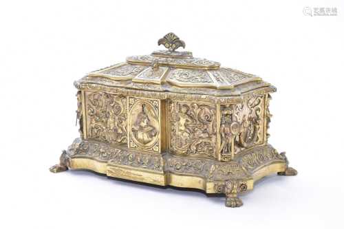 A late 19th century Continental relief moulded brass casket