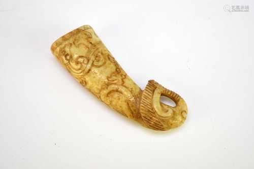 A Chinese mottled 'chicken bone' jade rhyton cup