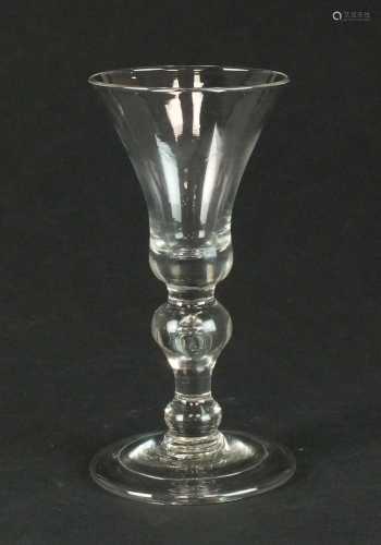 A heavy baluster wine glass, circa 1710