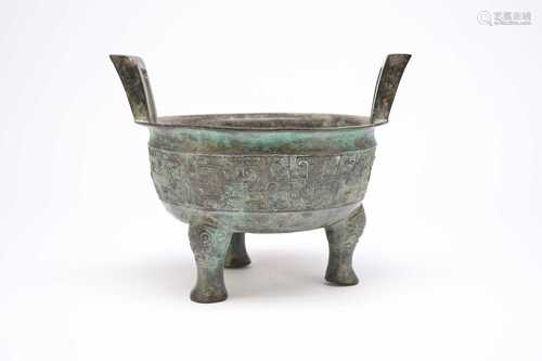 A Chinese Shang/Zhou Dynasty style bronze tripod censer