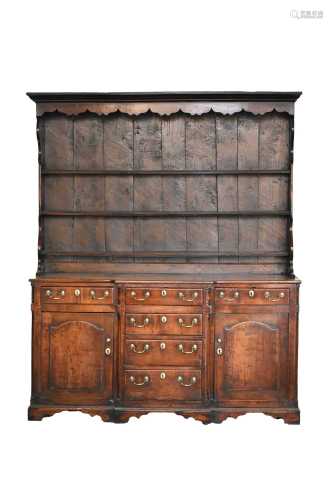 A late 18th century fruitwood or yew wood breakfront dresser...